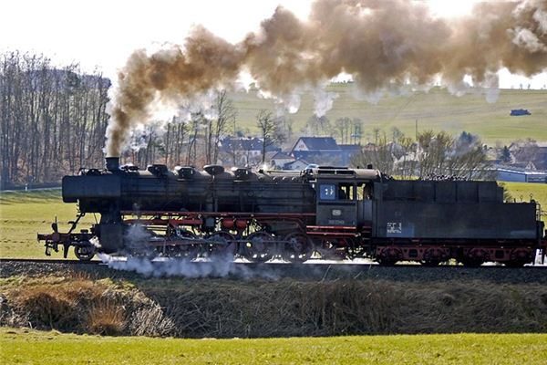 What is the meaning and symbolism of riding a train in a dream?