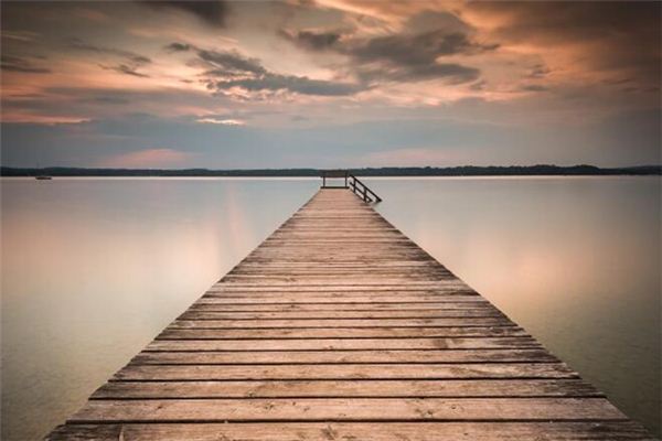 What is the meaning and symbol of crossing the single-plank bridge in the dream?