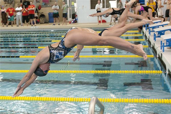 What is the meaning and symbol of the swimming competition in the dream?