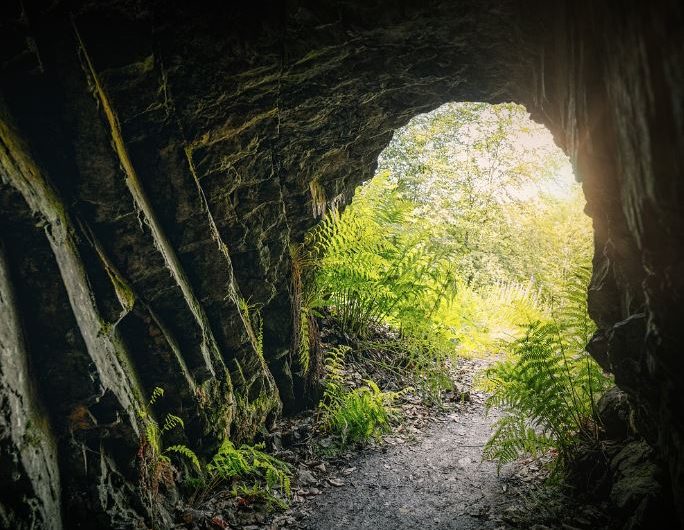 What does dreaming of a cave symbolize?